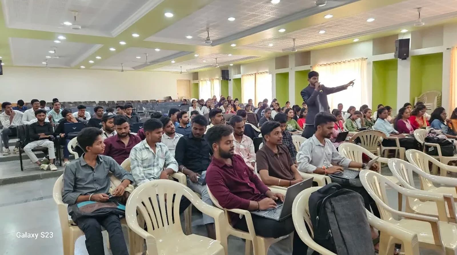 Students attending a technology seminar by Akash Jadhav in a college hall