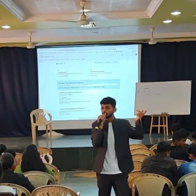 Akash Jadhav delivering a student session on stage at Gadag Betageri, Karnataka